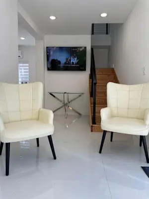 two white chairs and a table in a room at In the heart of little Havana 5 in Miami