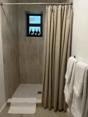 a shower with a shower curtain in a bathroom at Near Brickell, Beach & Port 10min, Style & Comfort in Miami