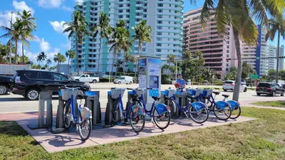 a row of bikes parked next to parking meters at Amazing ocean view studio 14 floor Free parking in Miami Beach