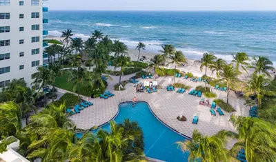 an aerial view of the pool and beach at the resort at Hollywood Beachfront 2-Bedroom Condo with Ocean Views in Hollywood