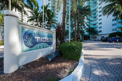 a sign for one tides spa on a street at Hollywood Beachfront 2-Bedroom Condo with Ocean Views in Hollywood