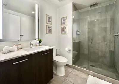 a bathroom with a shower and a toilet and a sink at SPECIAL OFFER - Luxury High Rise Downtown Miami - Bay Views and Top Amenities in Miami