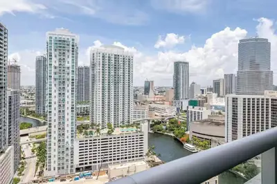 a view of a city with a river and buildings at Beautiful Icon Brickell Double height ceiling in Miami