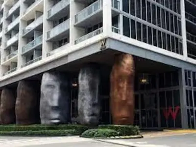 a building with large vases on the side of it at Beautiful Icon Brickell Double height ceiling in Miami