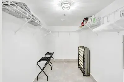 a room with white walls and a white ceiling at Stylish Brickell Condo with Balcony and Parking in Miami