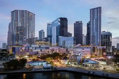 a city skyline with tall buildings and a river at Stylish Brickell Condo with Balcony and Parking in Miami