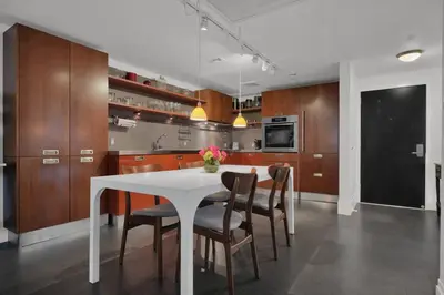 a kitchen with a white table and chairs at Coastal Elegance and Luxury by the Water in Miami