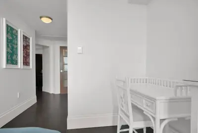 a white desk in a room with a hallway at Coastal Elegance and Luxury by the Water in Miami