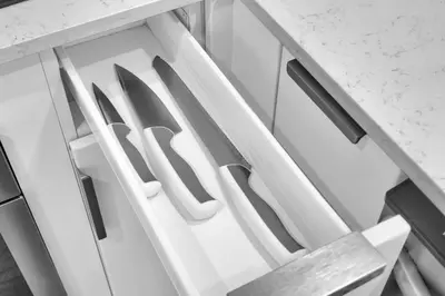 a kitchen drawer with white handles on a counter at The Harmony - Ocean and Relaxation in Miami