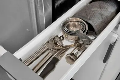 a drawer with a bunch of silver utensils in it at The Harmony - Ocean and Relaxation in Miami