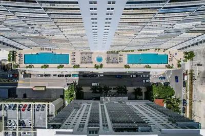 a view of a large building with a pool at Stunning 2B2B Ocean and City Views with Free Parking in Miami