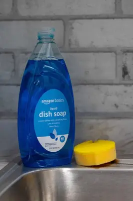 a bottle of blue dish soap next to a banana at Luxury Miami Studio Close to Wynwood & Downtown in Miami