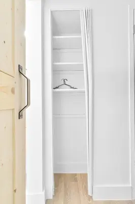 a door into a closet with a hanger at Luxury Miami Studio Close to Wynwood & Downtown in Miami