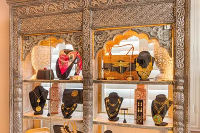 a display cabinet filled with different types of items at Henrosa Hotel in Miami Beach