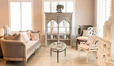 a living room with a couch and a table and chairs at Henrosa Hotel in Miami Beach