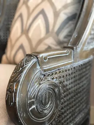 a close up of a silver camera sitting on a table at Henrosa Hotel in Miami Beach
