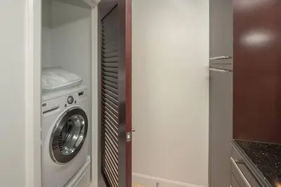 a washer and dryer in a small kitchen at Fontainebleau Sorrento Jr suite in Miami Beach