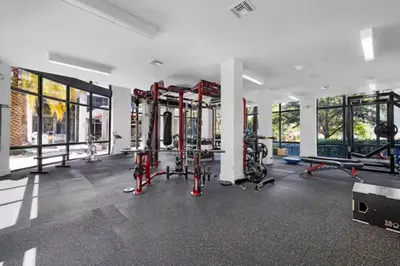 a gym with treadmills and machines in a room at Aqua Luxe in DTWN 3 Min From Las Olas in Fort Lauderdale