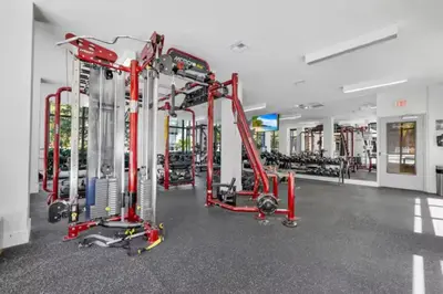 a gym with red equipment in a room at Isla Blue in DTWN 3 Min From Las Olas in Fort Lauderdale