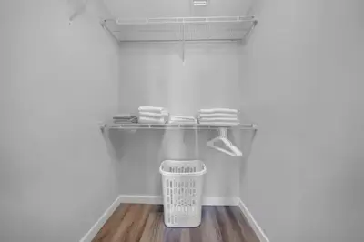 a mixer in a kitchen with a shelf on the wall at Modern Palmera in DTWN 3 Min From Las Olas in Fort Lauderdale