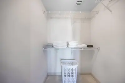 a white refrigerator with a white basket in a room at Serene Bleu in DTWN 3 Min From Las Olas in Fort Lauderdale