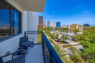 a balcony with a view of a city at Serene Bleu in DTWN 3 Min From Las Olas in Fort Lauderdale