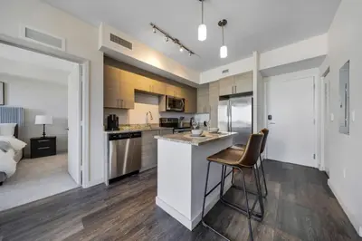 an open kitchen and living room in a apartment at The Serenity in DTWN 3 Min From Las Olas in Fort Lauderdale