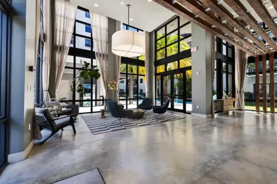 an open living room with a lobby with windows at The Serenity in DTWN 3 Min From Las Olas in Fort Lauderdale