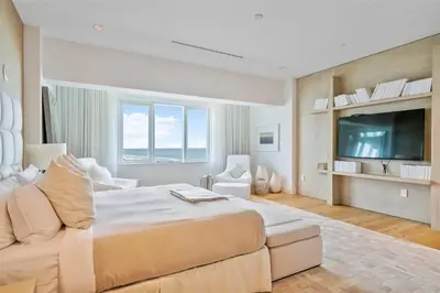 a large bedroom with a large bed and a television at Villa Royale Residences in Miami Beach