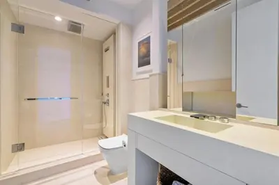 a bathroom with a sink and a toilet and a shower at Villa Royale Residences in Miami Beach