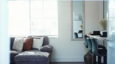 a living room with a couch and a window at Cozy Miami Home Next to Wynwood & Design District in Miami