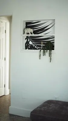 a white room with a picture on a wall at Cozy Miami Home Next to Wynwood & Design District in Miami