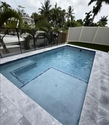 a large swimming pool in a building with palm trees at New Villa Near Hardrock Fll Wboating Near Beach in Fort Lauderdale