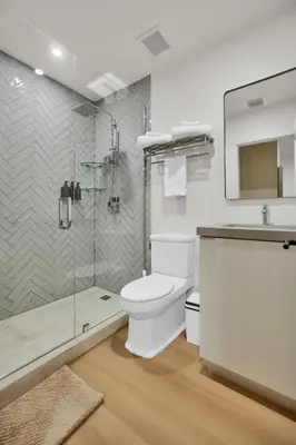 a bathroom with a toilet and a shower and a sink at Prestige Retreat by Renzzi in Miami