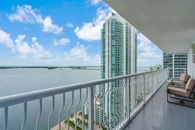 a balcony with a view of the water from a building at Stunning 3B2B with Ocean and City Views - Free Parking in Miami