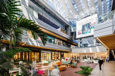 arium of a shopping mall with people in it at Miami Escape Parking Pool Near Wynwood in Miami