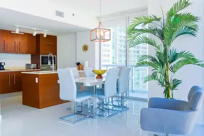 a kitchen and dining room with a table and chairs at Luxury Living in Brickell - Stunning City Views in Miami
