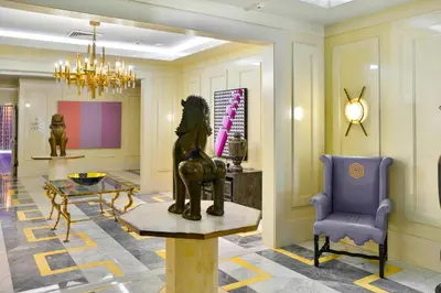 a lobby with a statue on a table and a chair at Luxury Living in Brickell - Stunning City Views in Miami