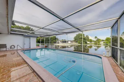 an indoor swimming pool with a large glass ceiling at 8 Mi to Beach! Miramar Guest Suite with Pool Access in Miramar