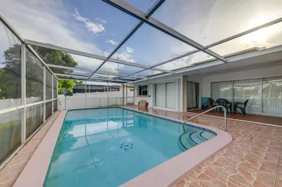 an indoor swimming pool with a retractable roof at 5 Mi to Hollywood Blvd! Miramar Apt with Shared Pool in Miramar