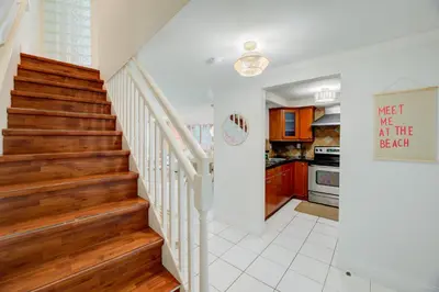 a staircase in a home with wooden floors at Casablanca Residences Miami Beach in Miami Beach