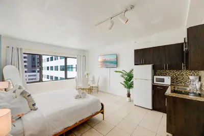 a kitchen with a large bed in a room at Casablanca Residences Miami Beach in Miami Beach