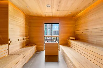 a sauna with wooden walls and a window at Downtown Luxury Stay with Complimentary Parking in Miami