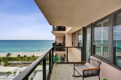 a balcony with a view of the ocean at Steps to the Beach 3BR 2BA Condo Resort Perks and Ocean Glimpse 1406 in Miami Beach