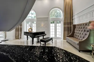 a living room with a piano and a couch at Miami Beach Paradise 4BR Stylish condo with Resort Perks 1007 in Miami Beach