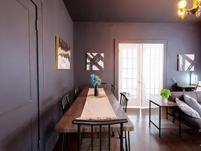 a dining room with a table and a couch at Cozy 2Bed 1Bath in Edgewater Miami in Miami