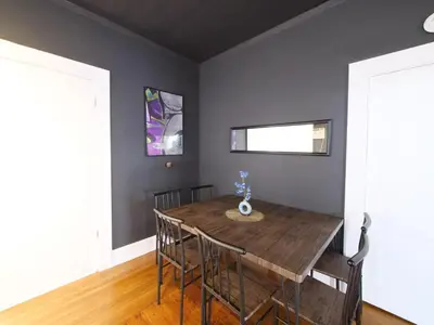 a dining room with a wooden table and chairs at Stylish Miami retreat-Edgewater in Miami