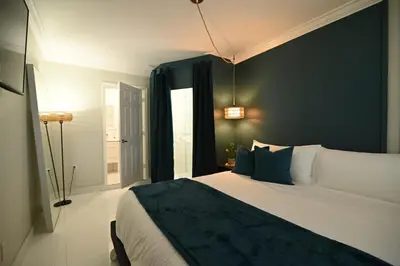 a bedroom with a large bed and a window at Olympia LUX House 4BR, Heated POOL, BBQ, BAR in Miami