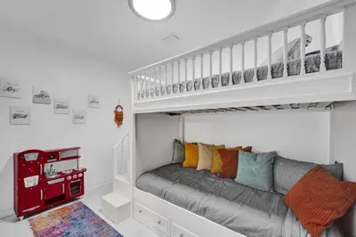 a bedroom with a bunk bed and a couch at Charming 3 bedroom getaway house in Hollywood in Hollywood