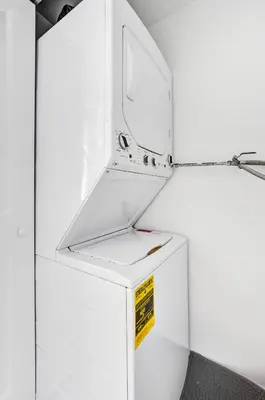 a white refrigerator with a sign on it at Charming 3 bedroom getaway house in Hollywood in Hollywood